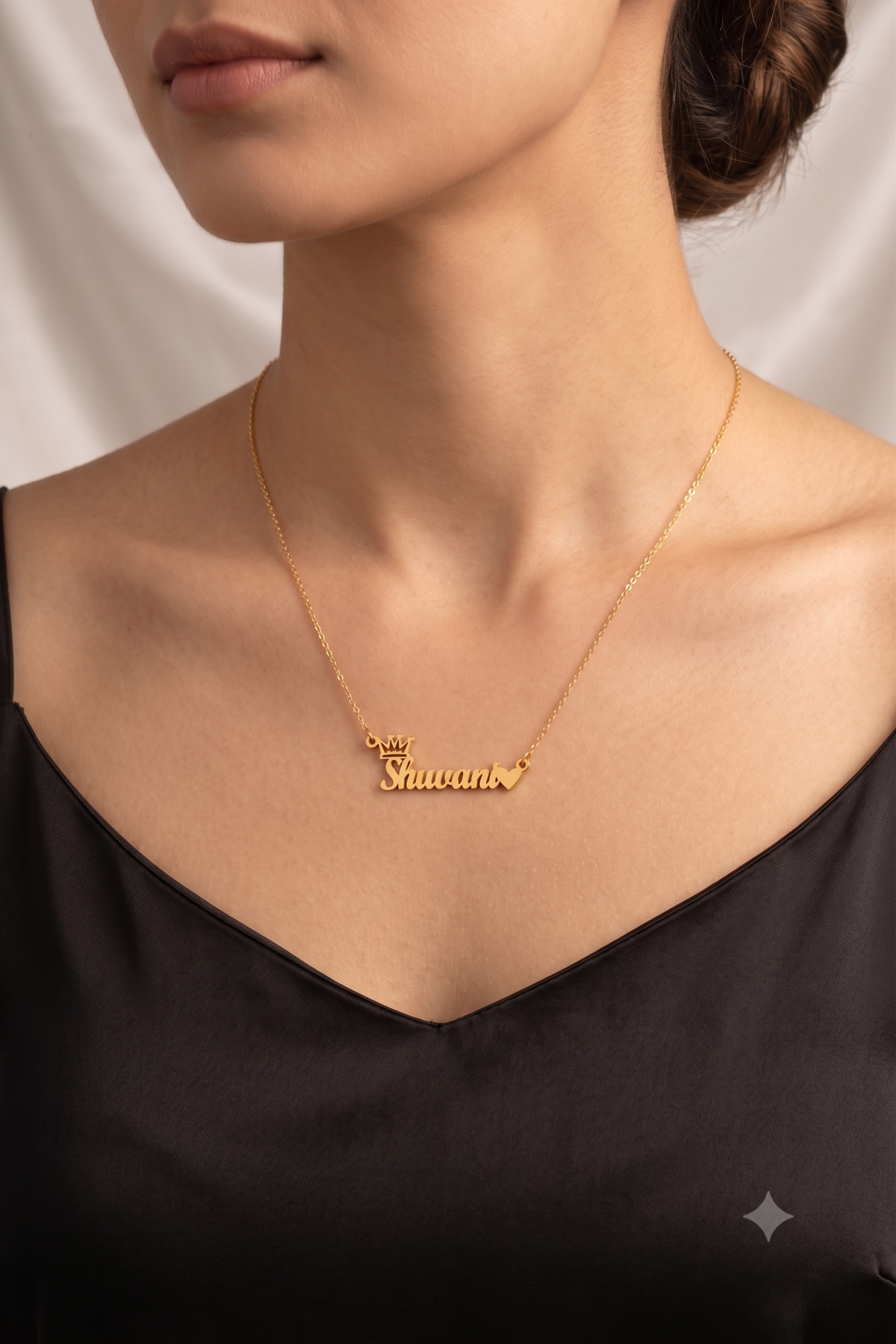 Crown name necklace worn on model