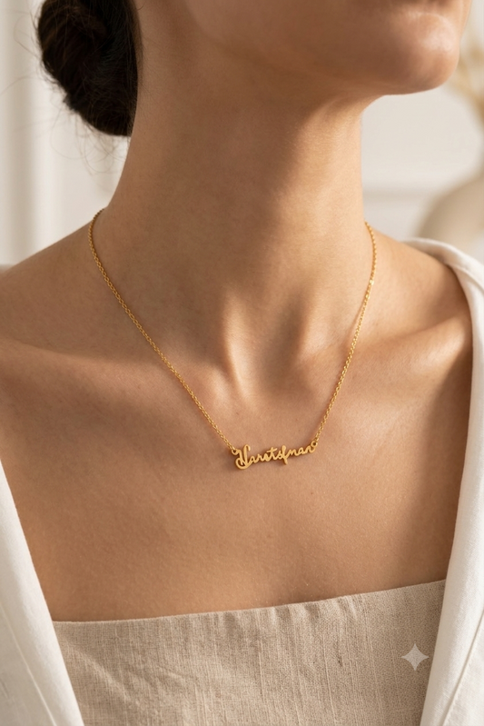 Signature name necklace worn on model