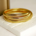 Elegant Gold-Toned Spiral Bangle Set