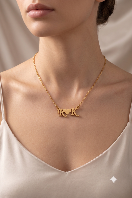 Couple initials heart necklace worn on model