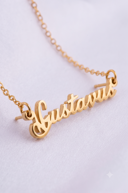 Close-up of cursive script name pendant